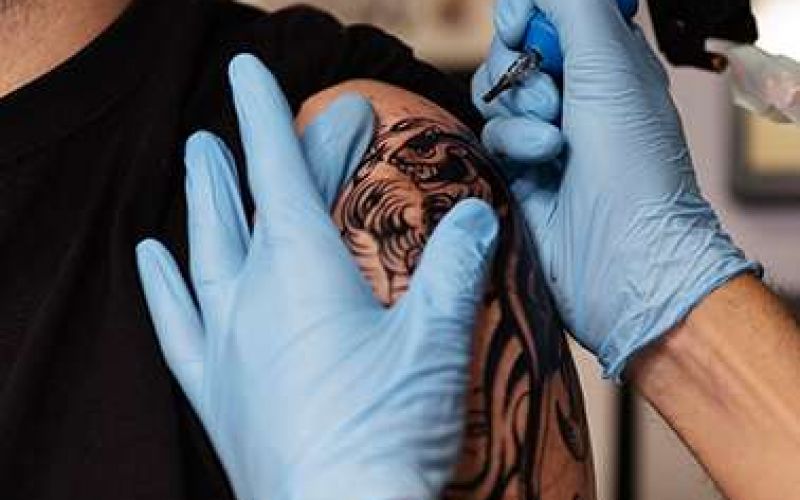 2 tattoo artists guide us into the modern world of tattooing